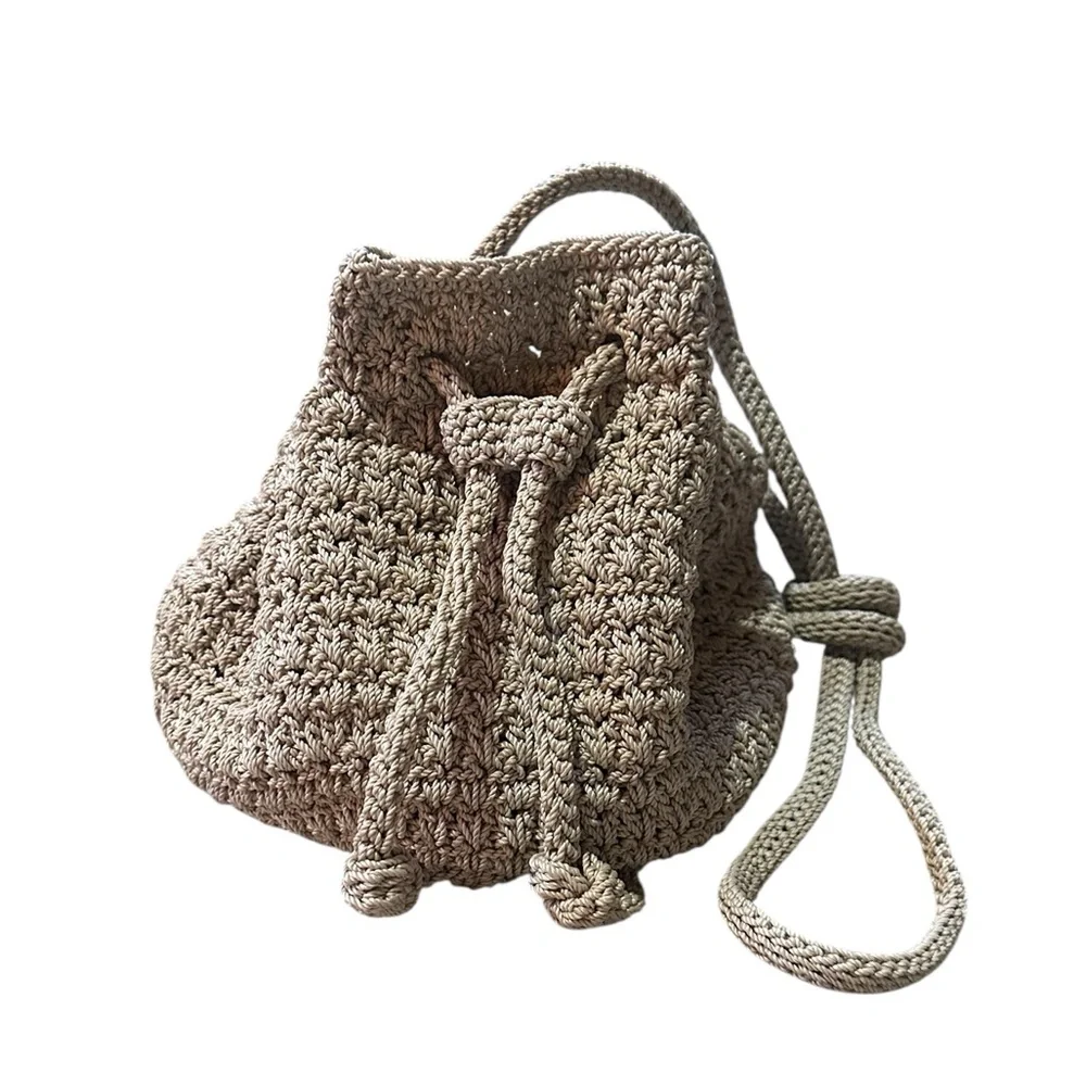 The Sak Crochet Crossbody Bucket Bag Floral Lining Draw Pull Closure Beige